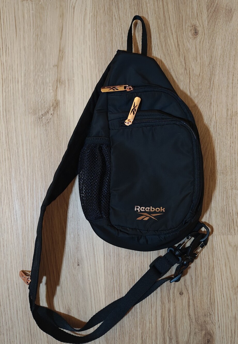 Reebok Black Sling Bag with Copper Accents
